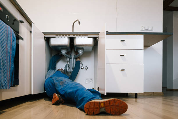 Professional Drain Cleaning technician working in Woonsocket, RI